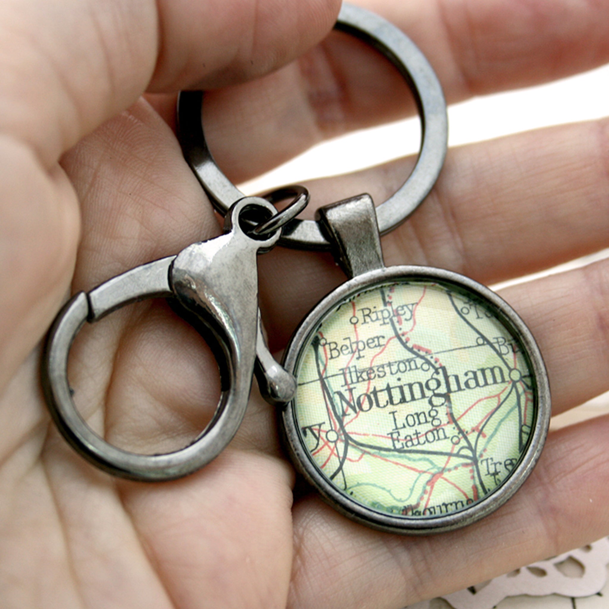 Hold in hand Personalised keyring in gunmetal black color featuring map of Nottingham