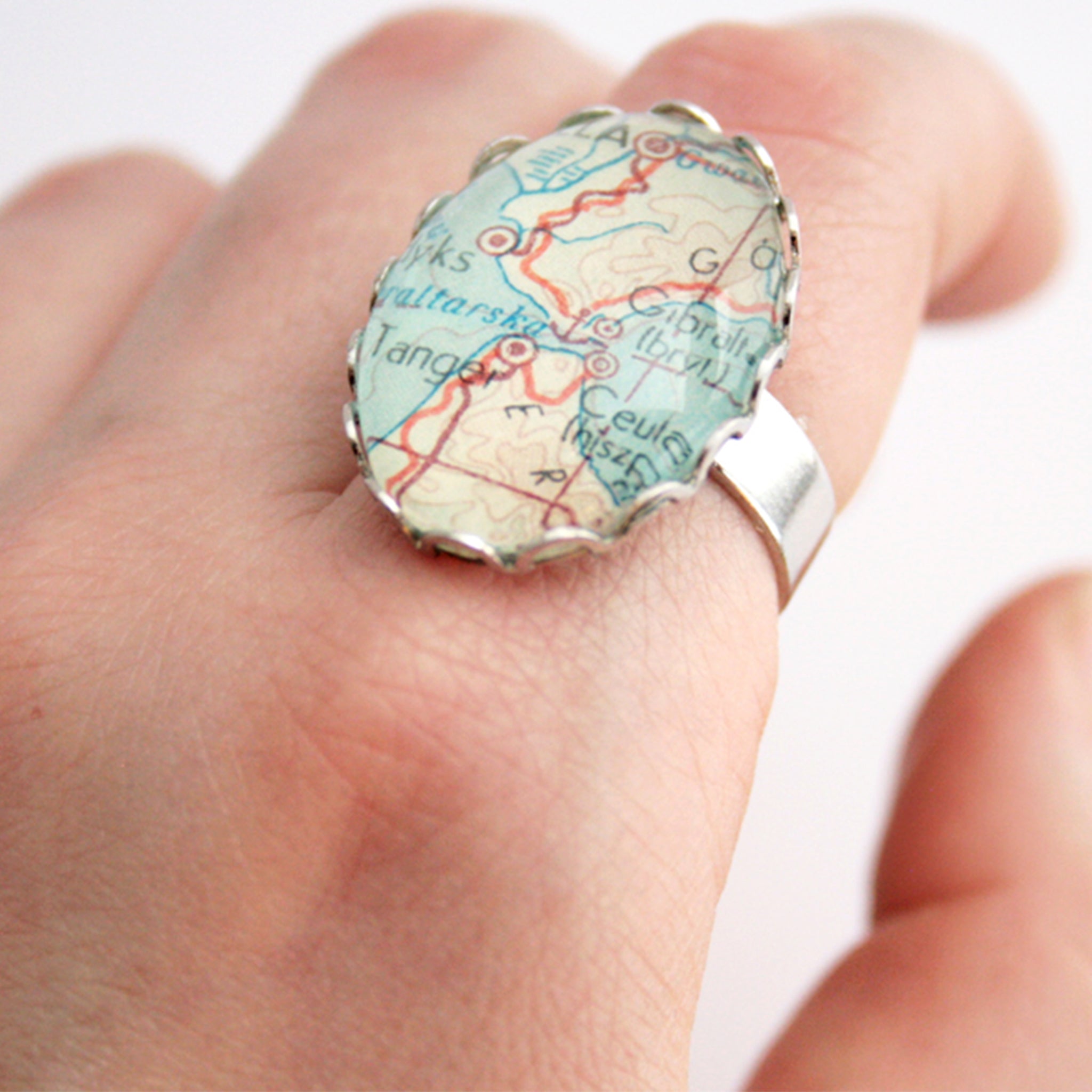 Oval silver ring personalised featuring map of Gibraltar worn on finger