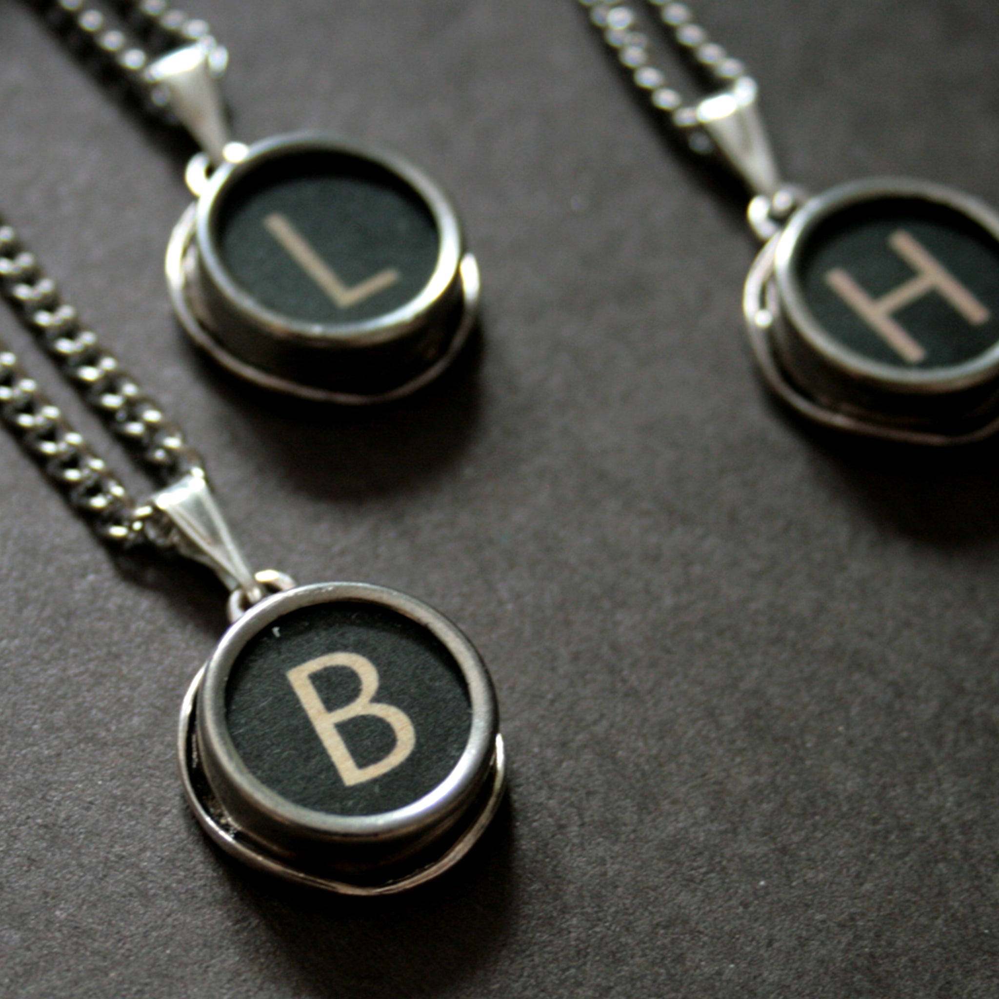 initial necklace made of authentic vintage black typewriter key