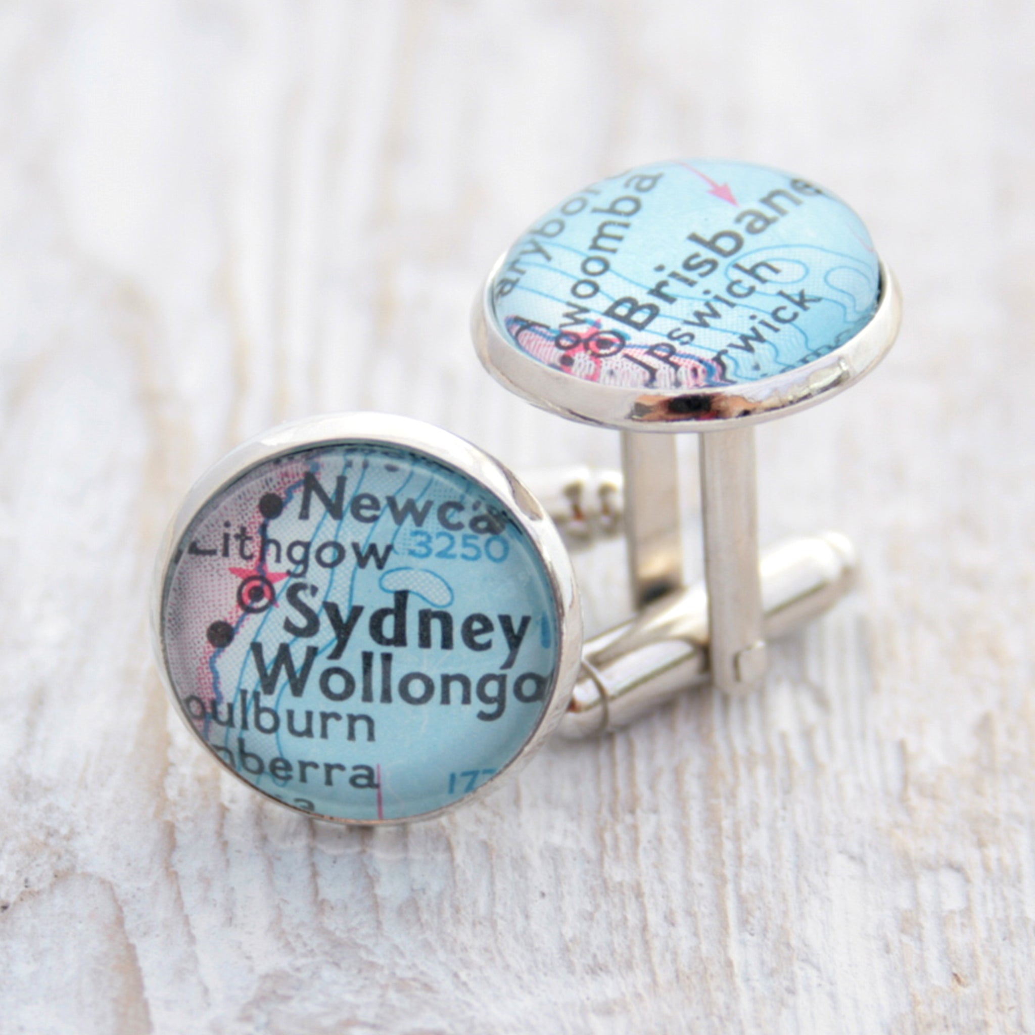 Personalised map cufflinks in silver tone featuring maps of Sydney and Brisbane