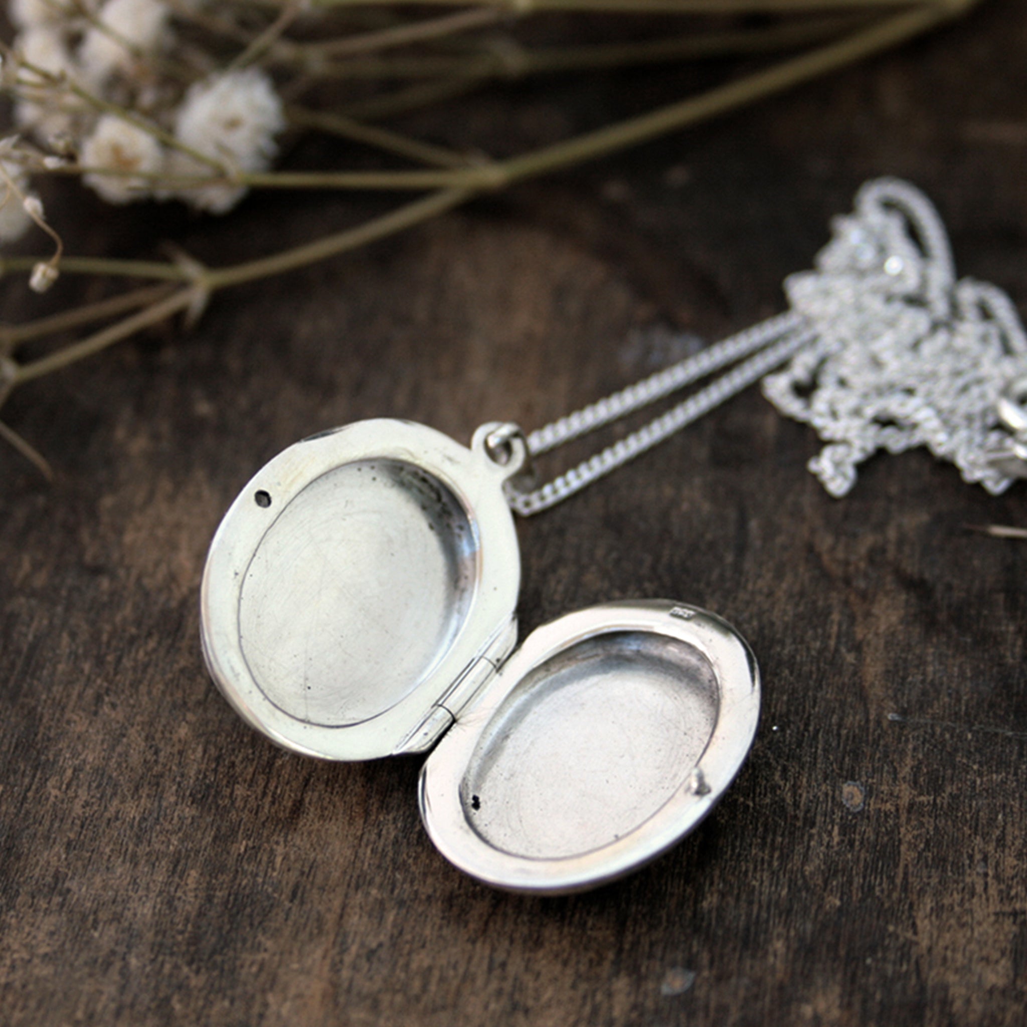 Opened sterling silver locket necklace