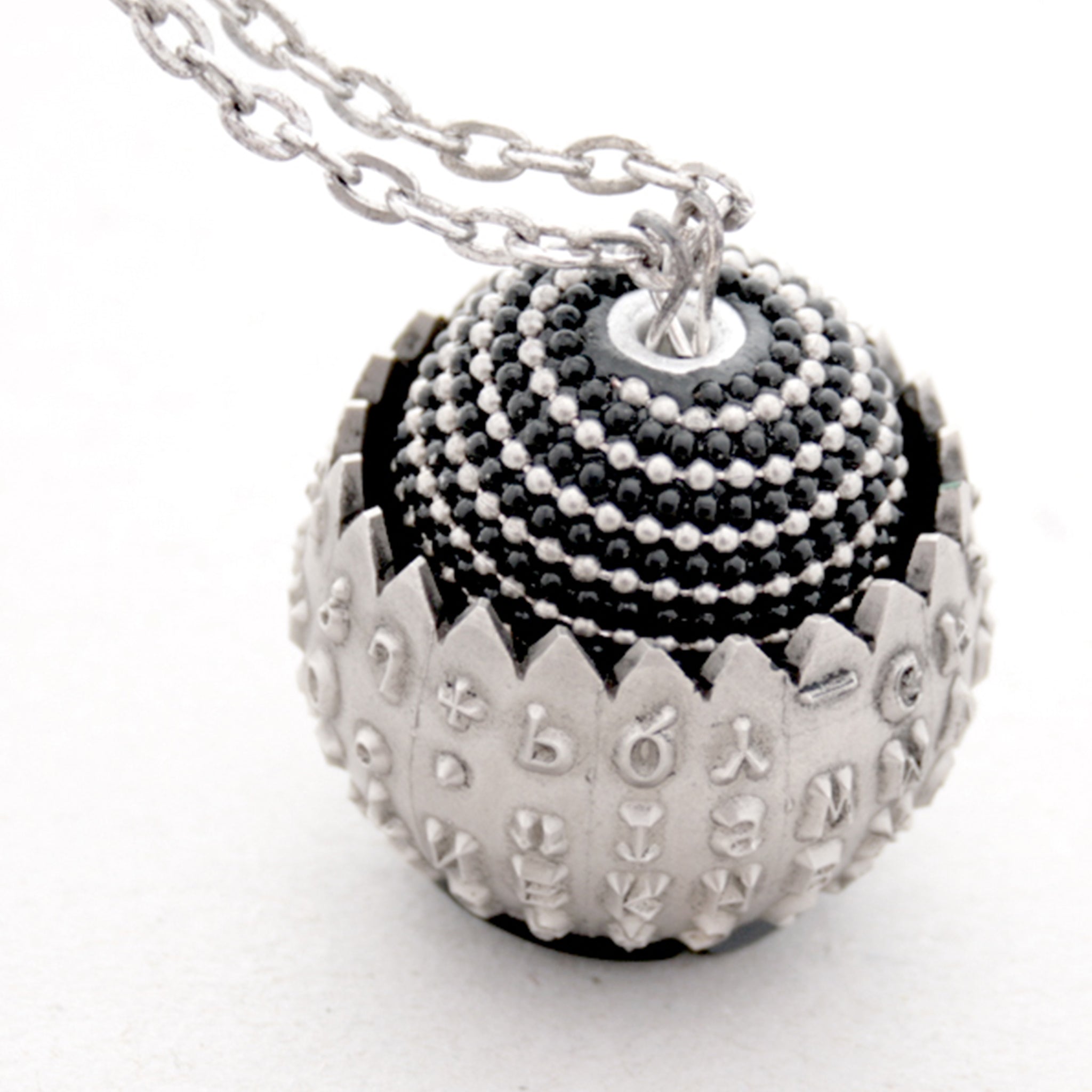 IBM Selectric typewriter font ball with large metal bead turned into eye catching necklace