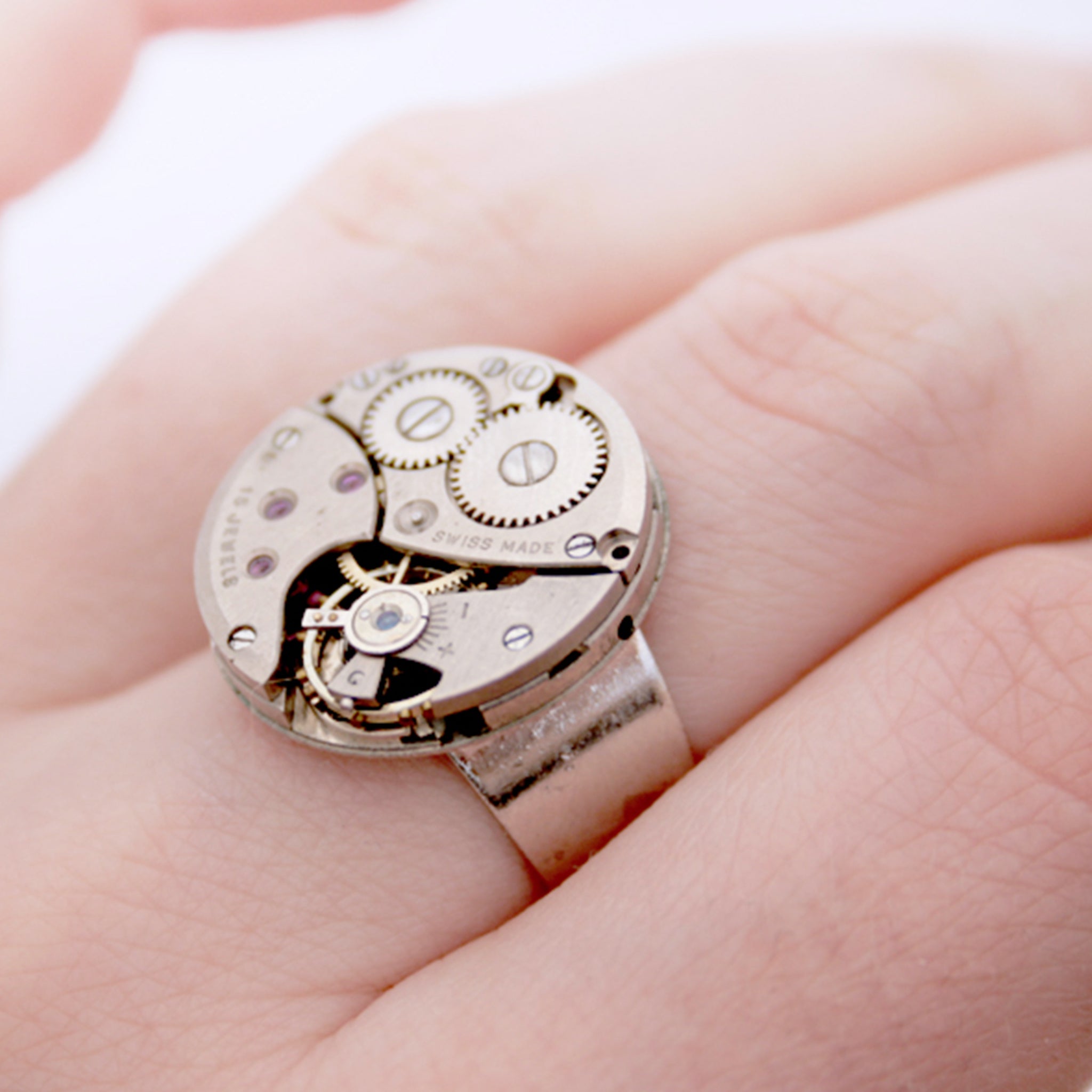 steampunk ring made of a real Swiss watch mechanism on hand