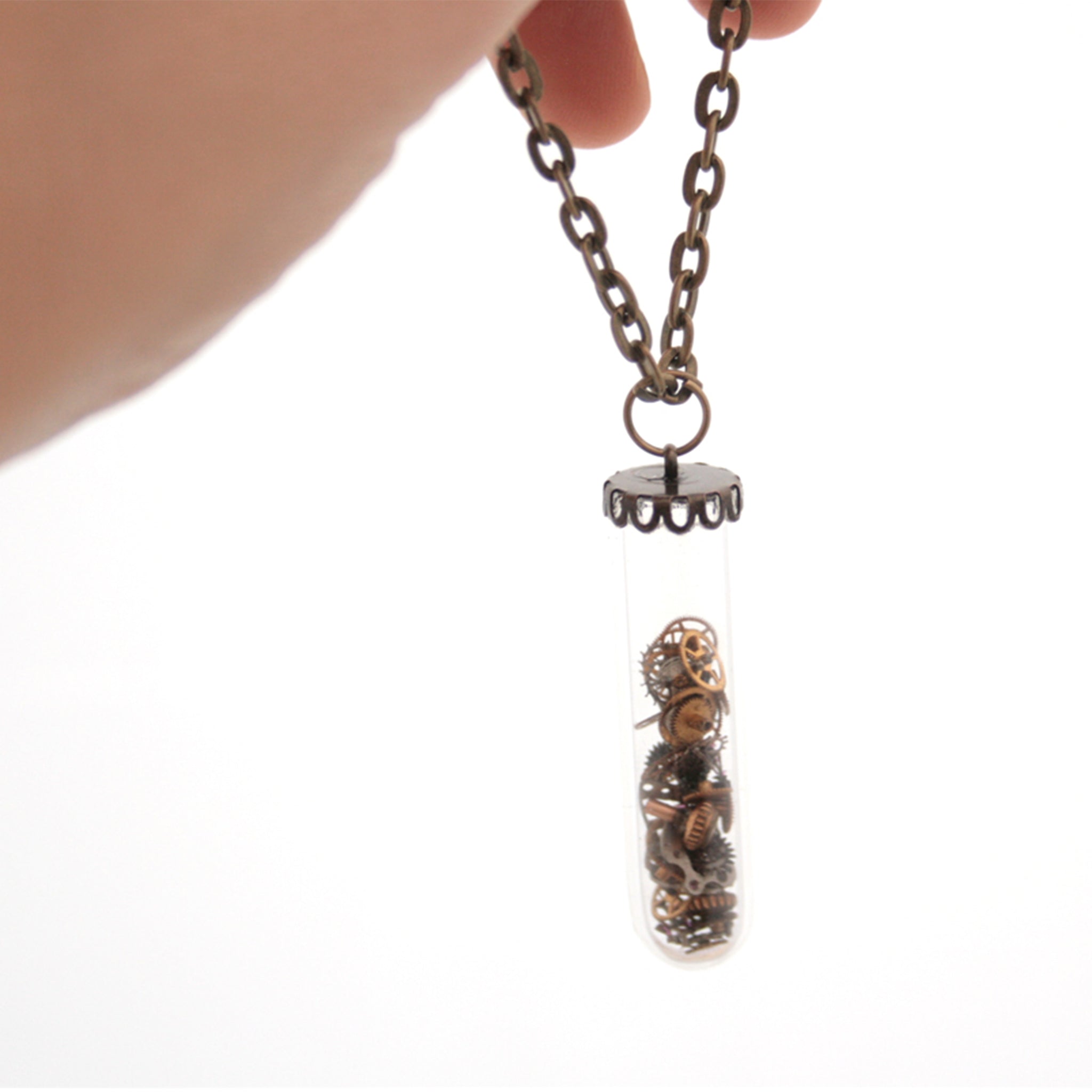 steampunk terrarium pendant necklace made of glass in vial shape filled with watch parts