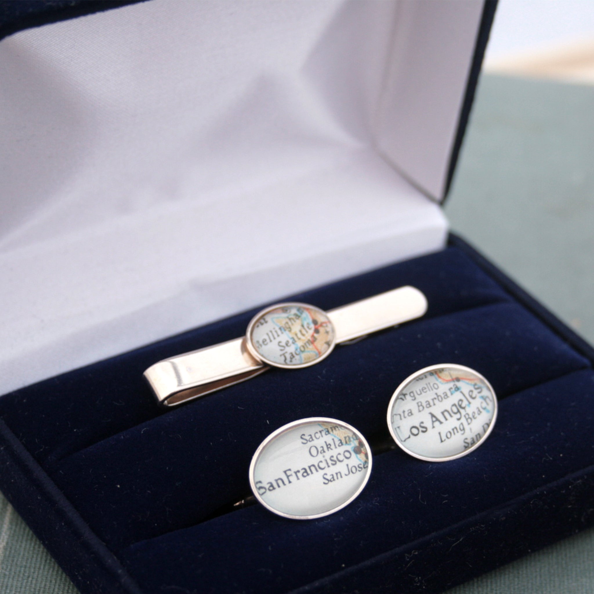 Sterling Silver Tie Clip and Cufflinks set featuring custom map locations in a blue presentation box