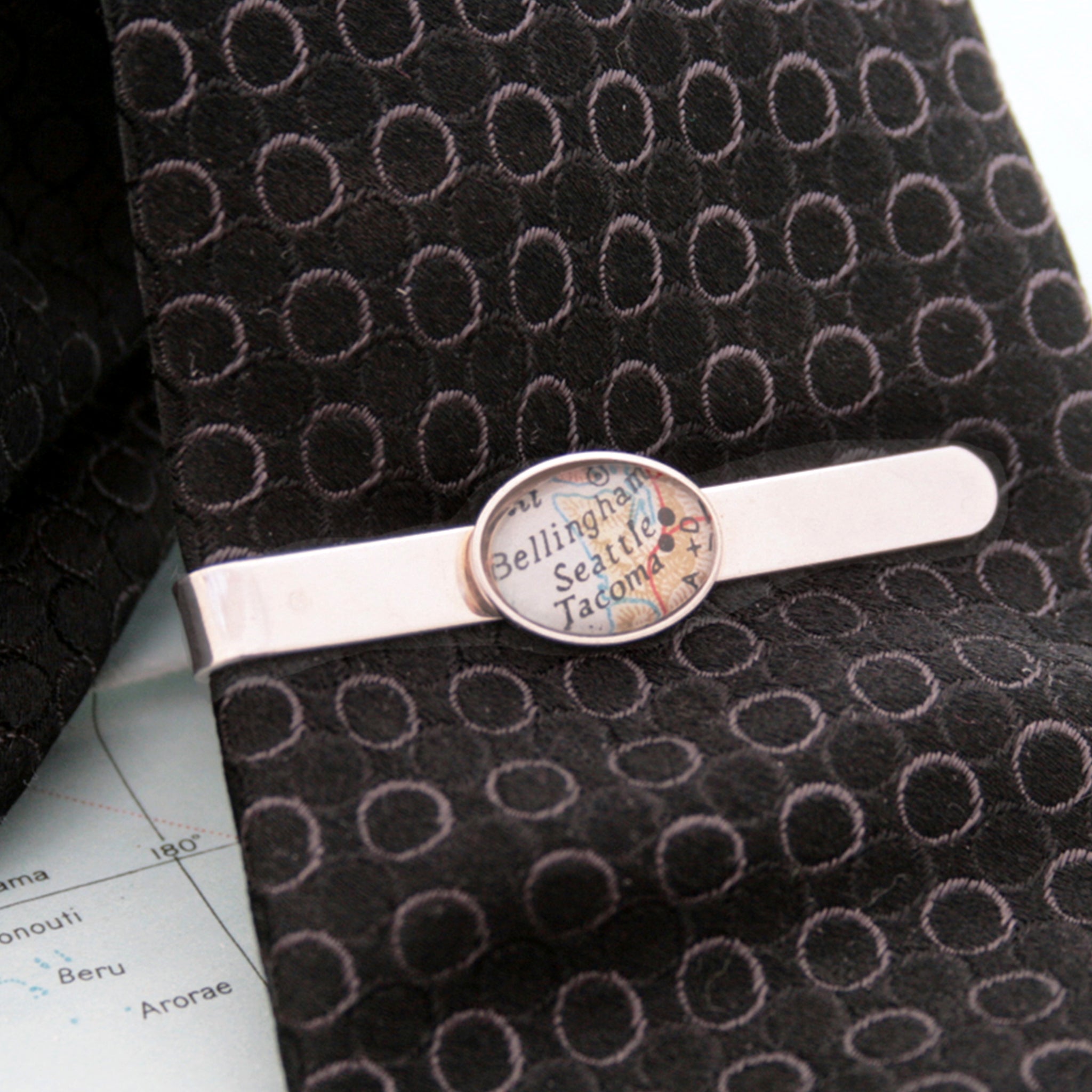  Sterling Silver tie clip that features custom map location on a black tie