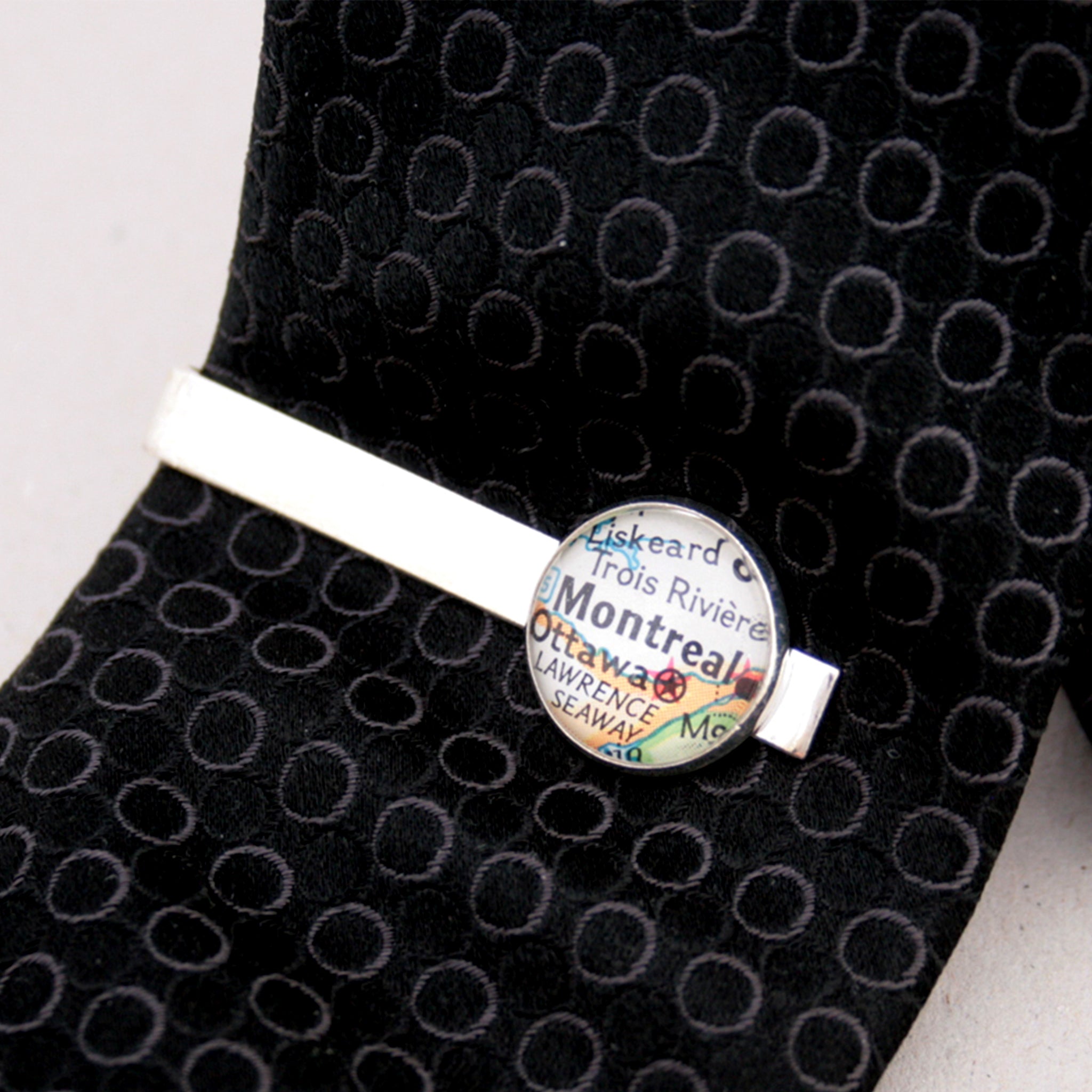 Personalised Tie Clip in silver color featuring map of Montreal on a black tie