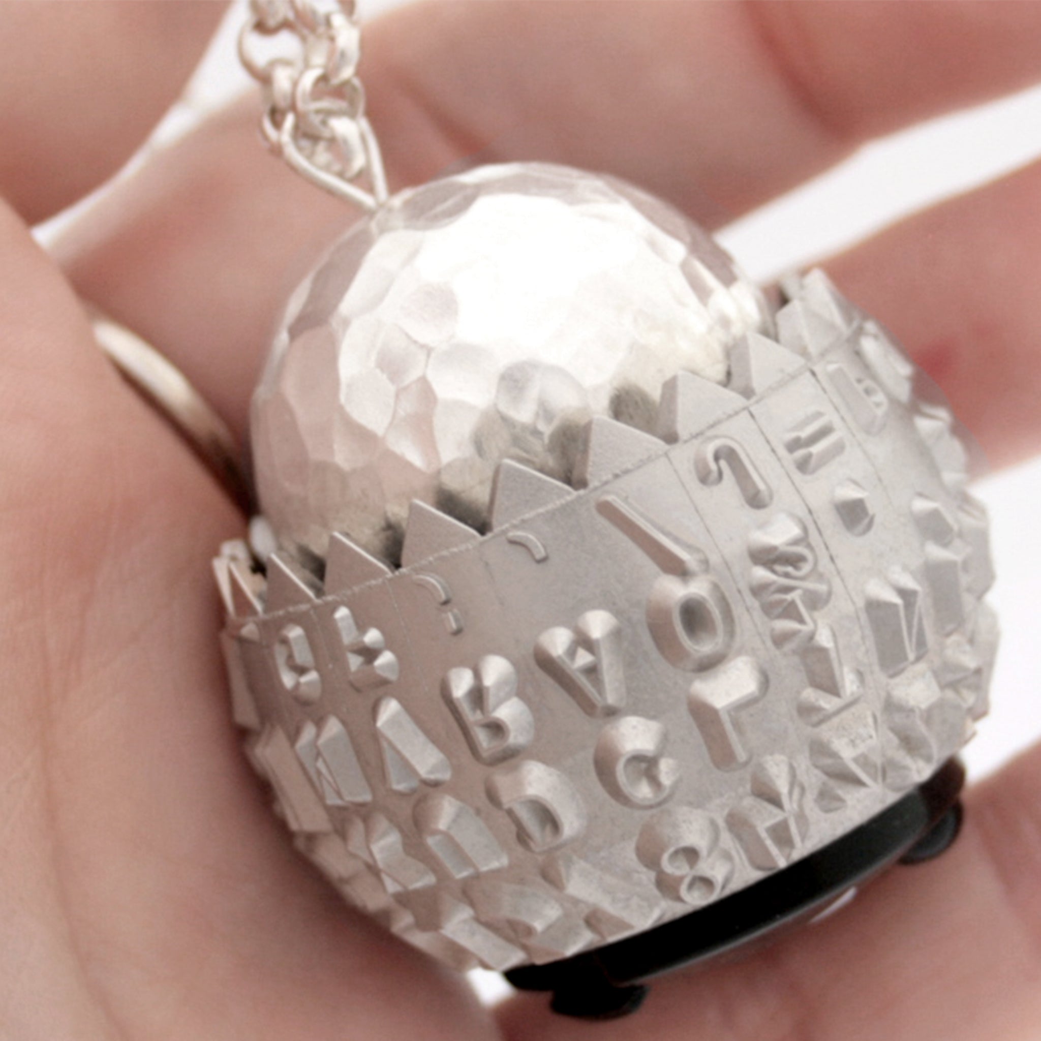 IBM Selectric typeball with sterling silver bead turned into quirky necklace