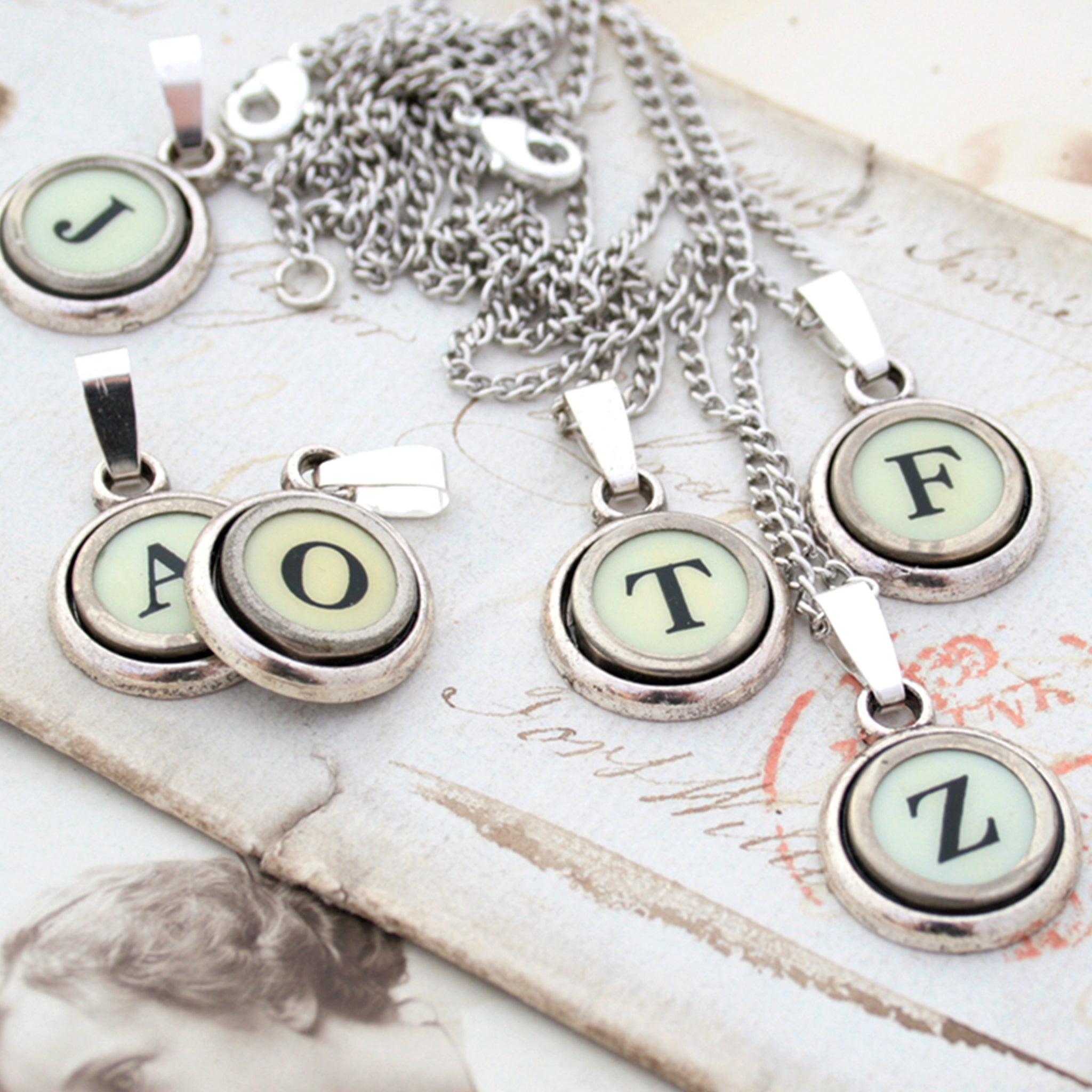 Ivory initial necklaces made of  typewriter keys