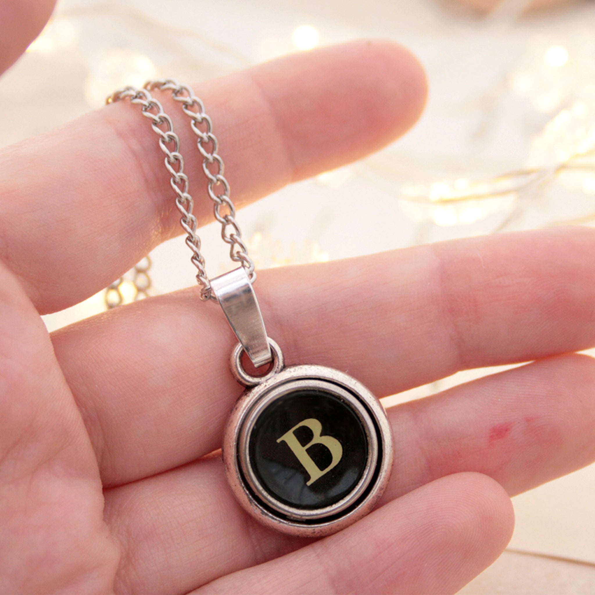 B letter typewriter necklaces made of real typewriter keys hold in hand