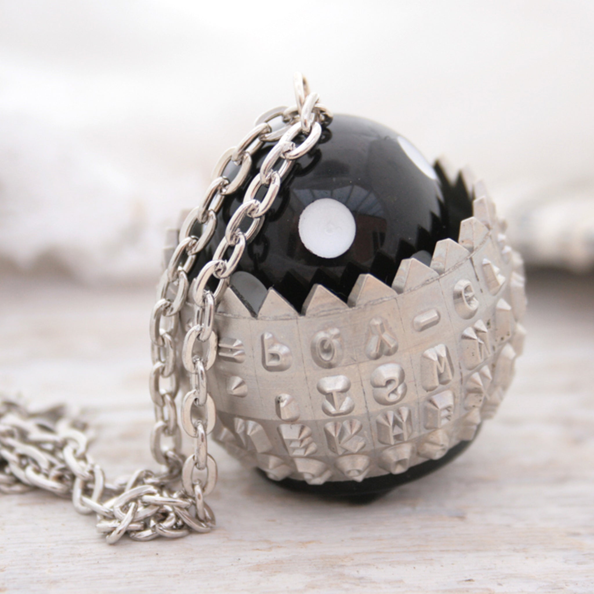  IBM Selectric typewriter font ball with large black and white bead turned into a necklace