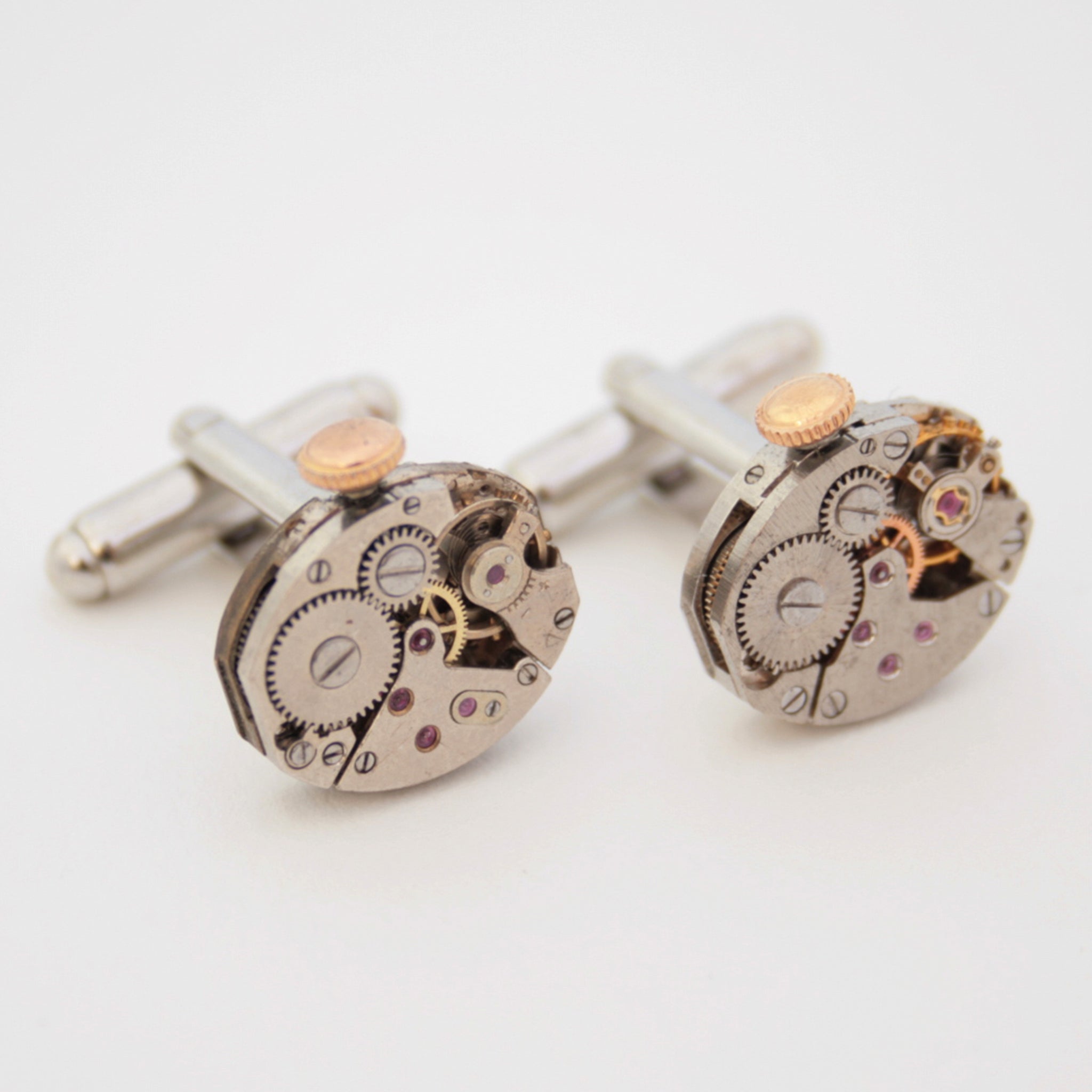steampunk wedding cufflinks featuring antique watch movements with wind ups