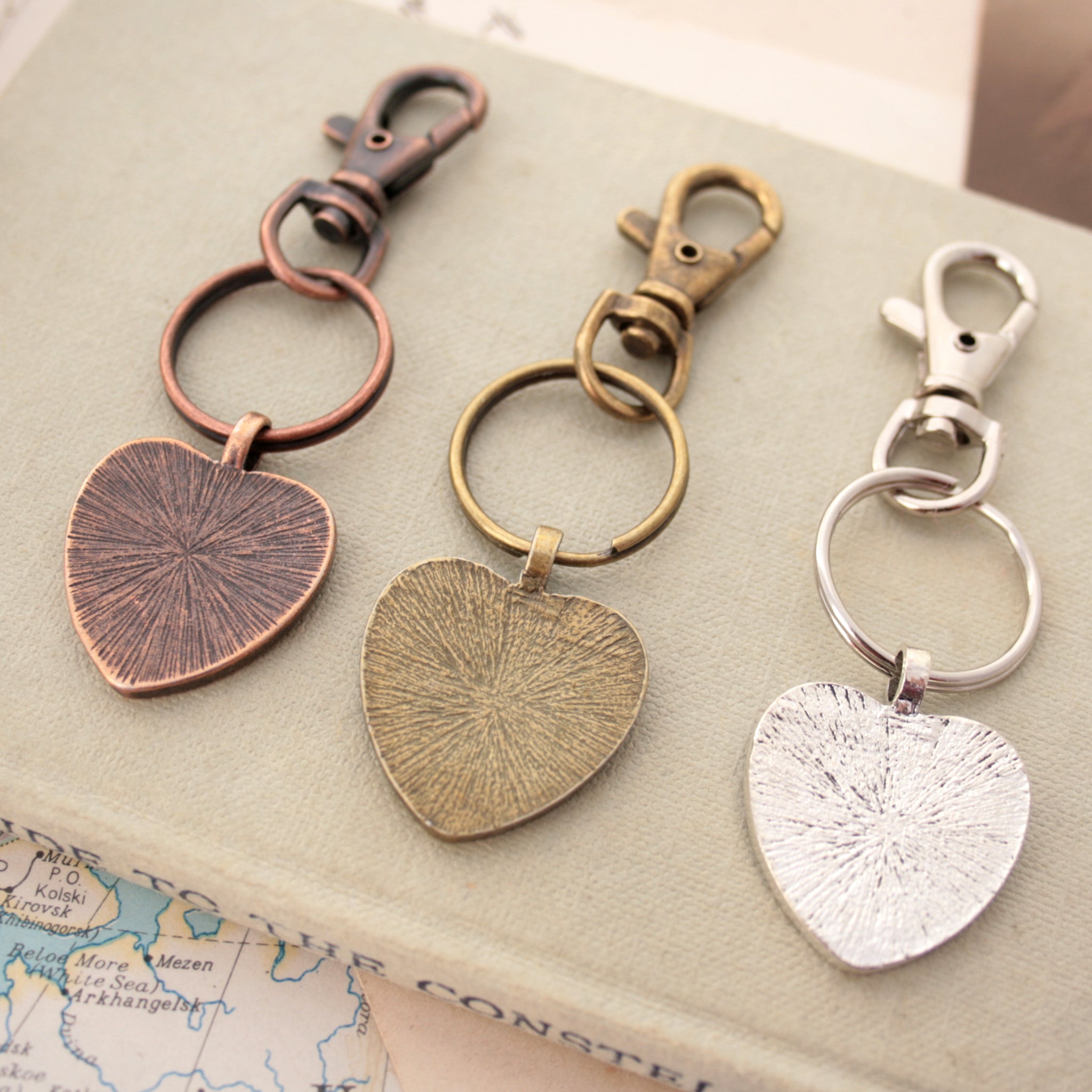 Copper, bronze and silver tone keychains in heart shape