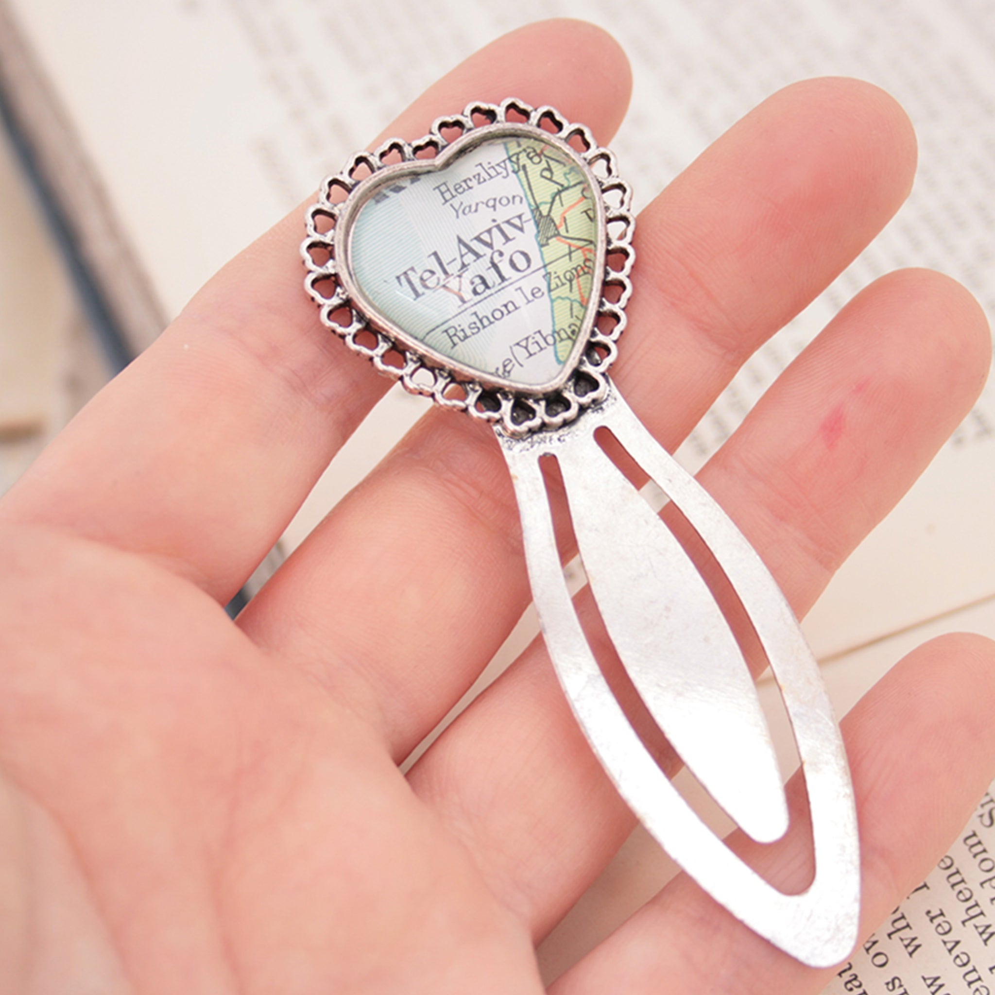 hold in hand metal bookmark in heart shape personalised with map of Tel Aviv