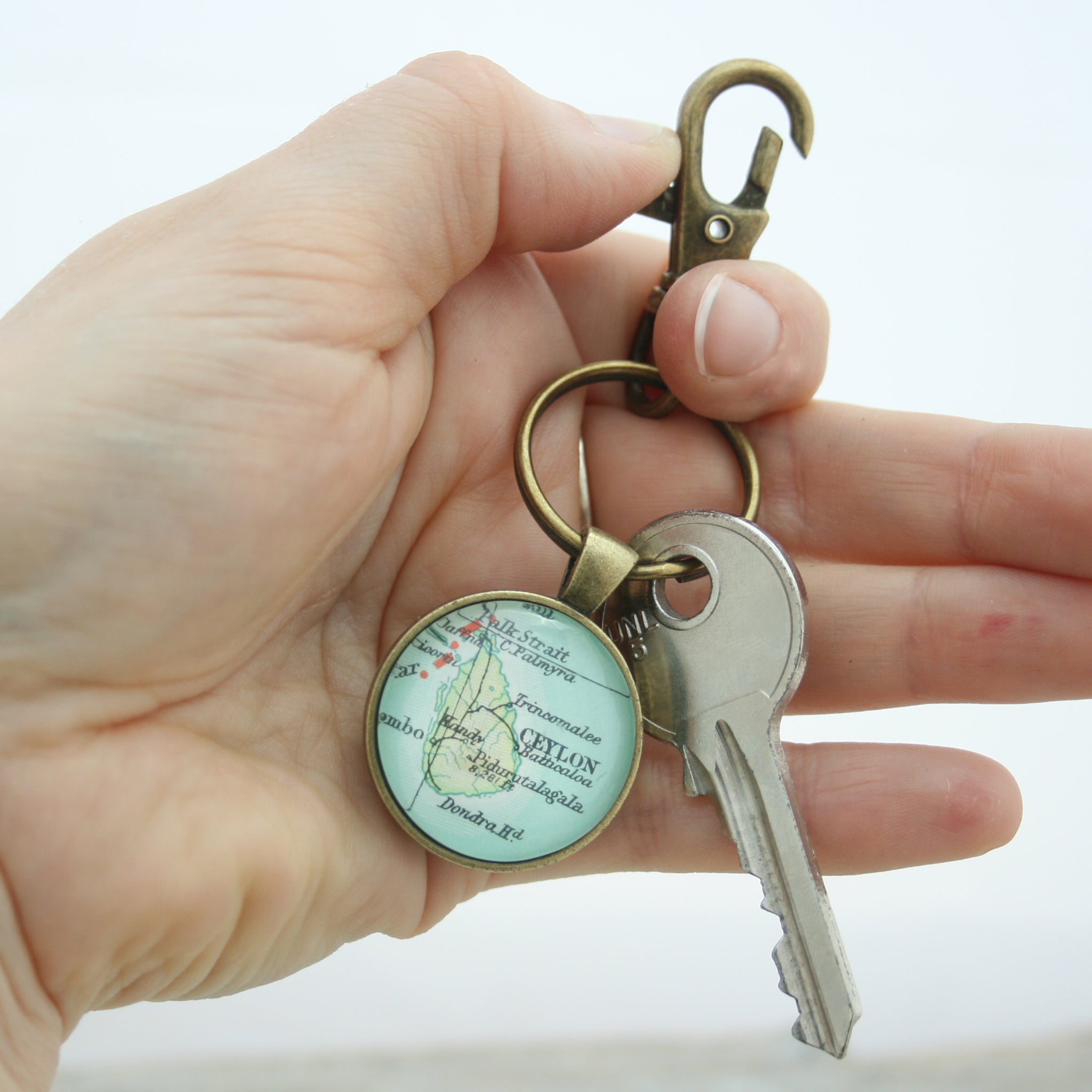 Hold in hand Personalised Keyring in bronze color featuring map of Ceylon