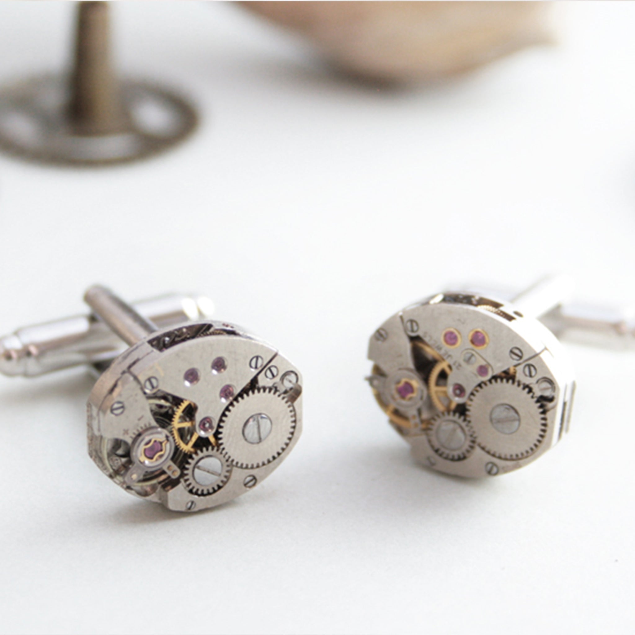 Cufflinks featuring old clock parts