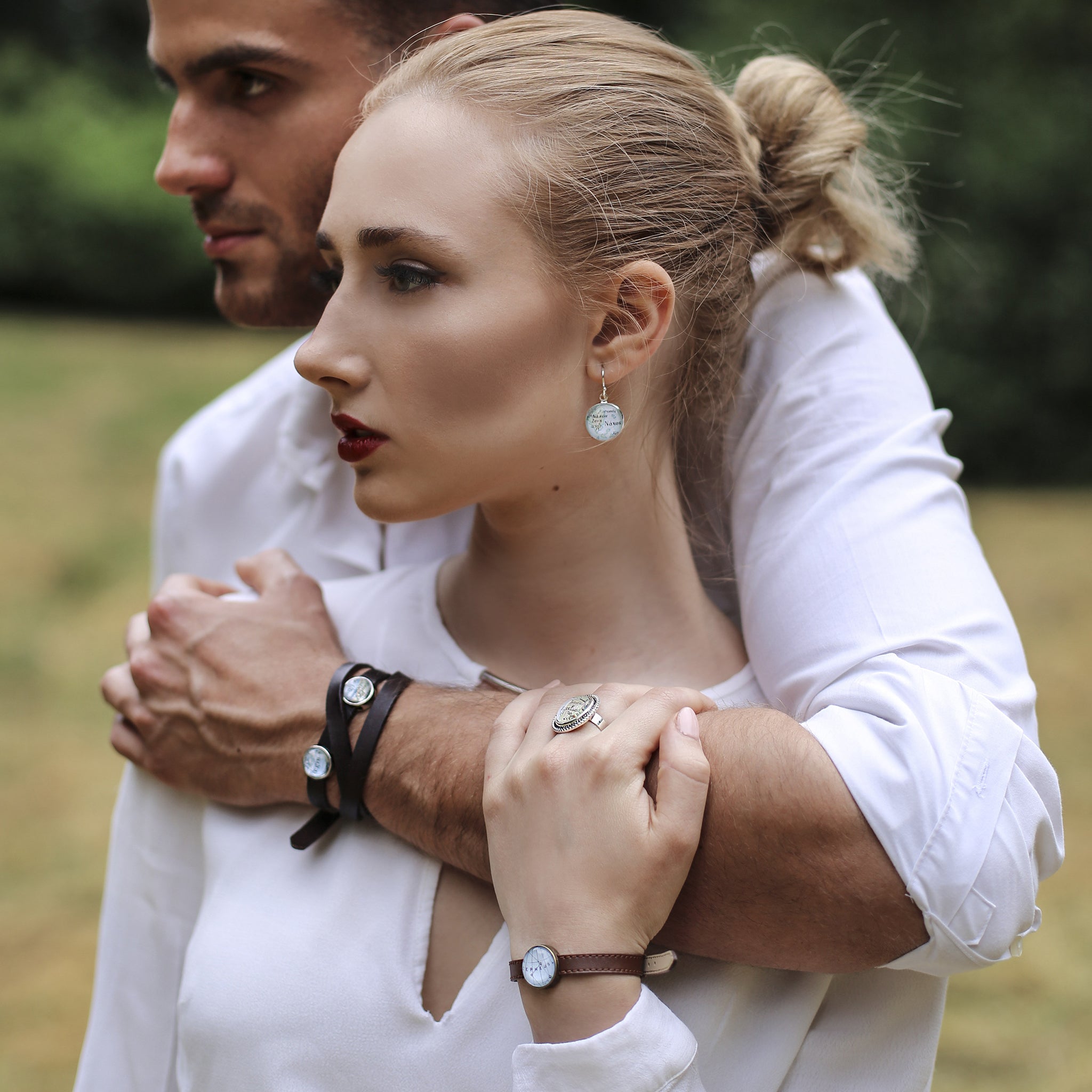 Model wearing Black leather bracelet with custom map location bead