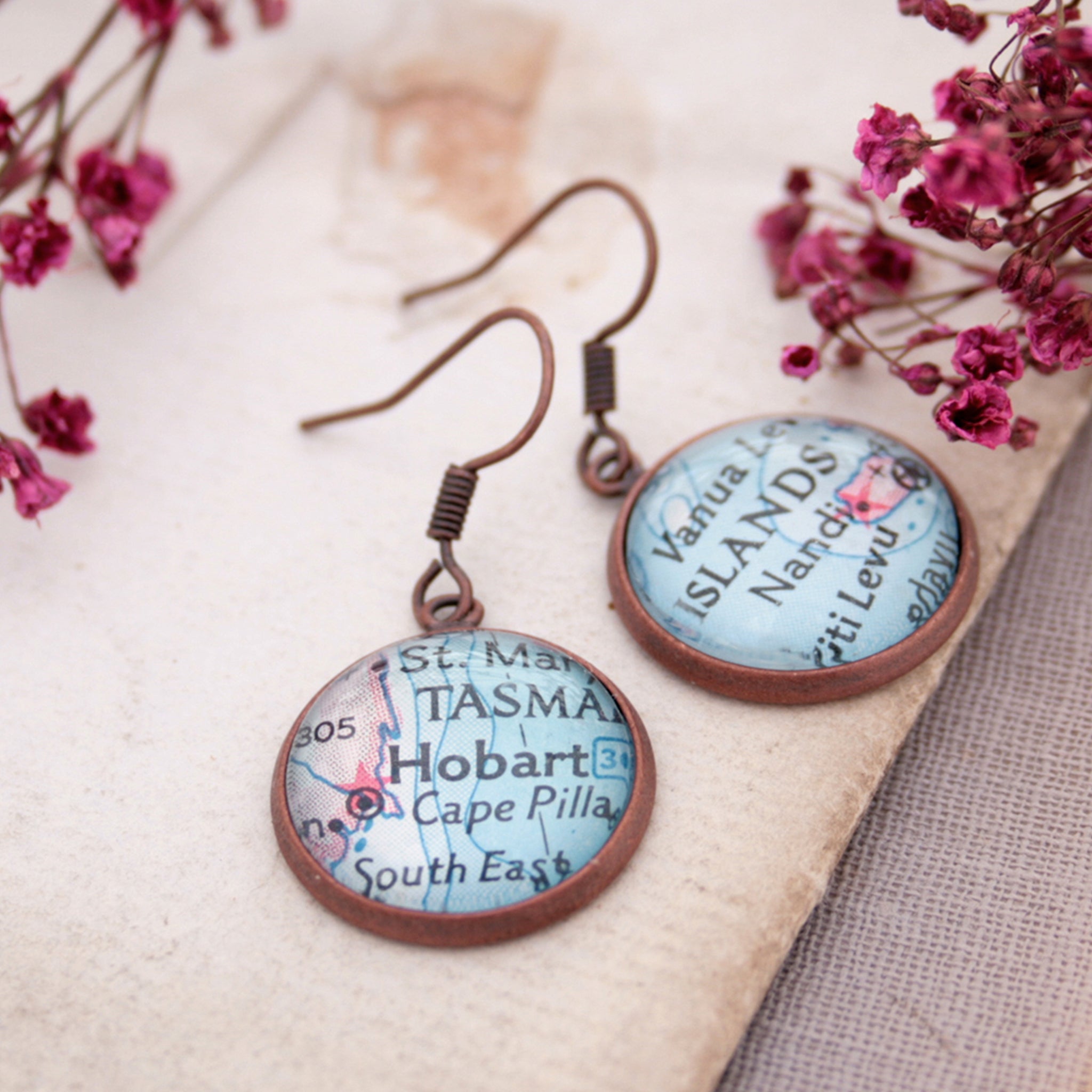 Copper dangle earrings featuring maps of Hobart