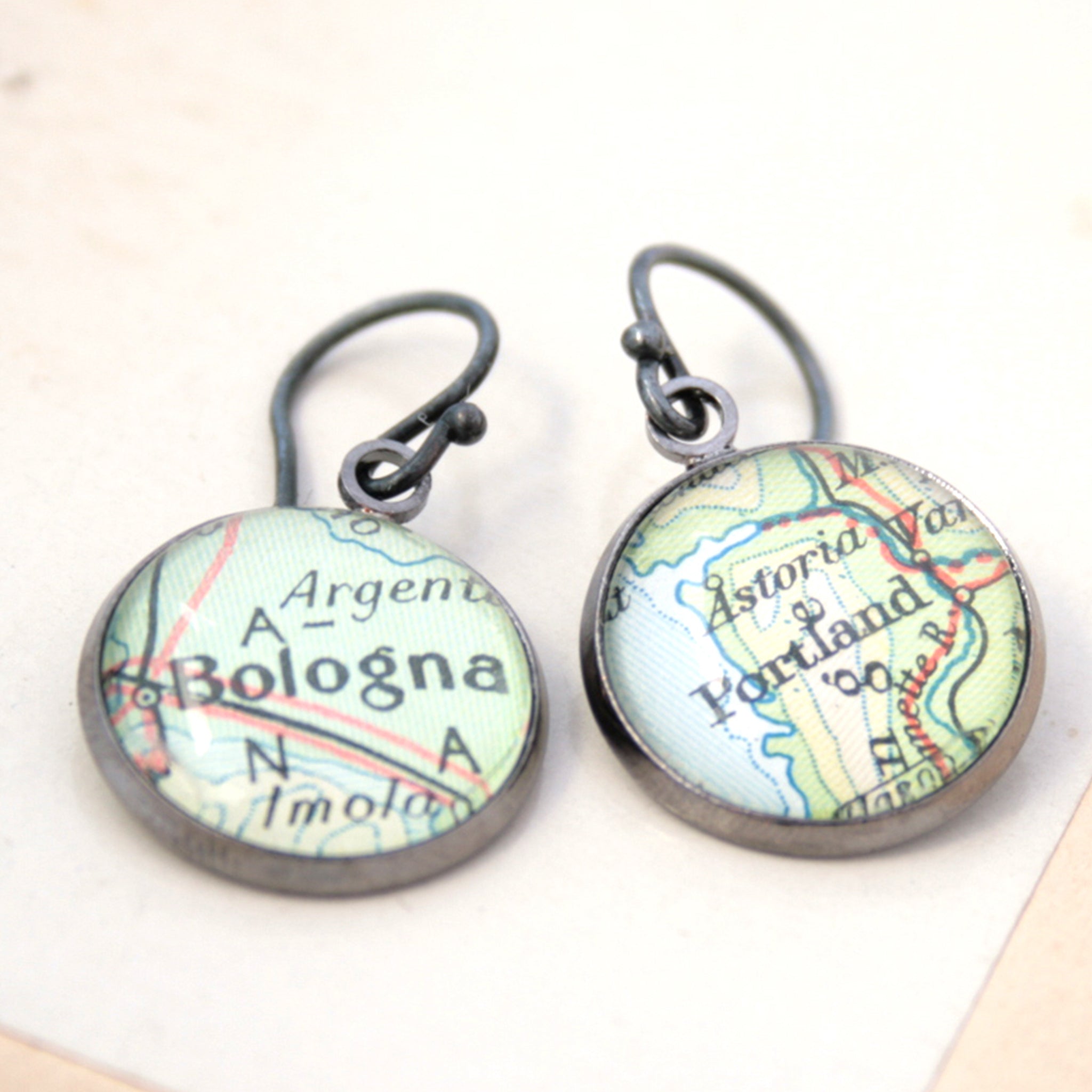 Gunmetal dangle earrings featuring maps of Bologna and Portland