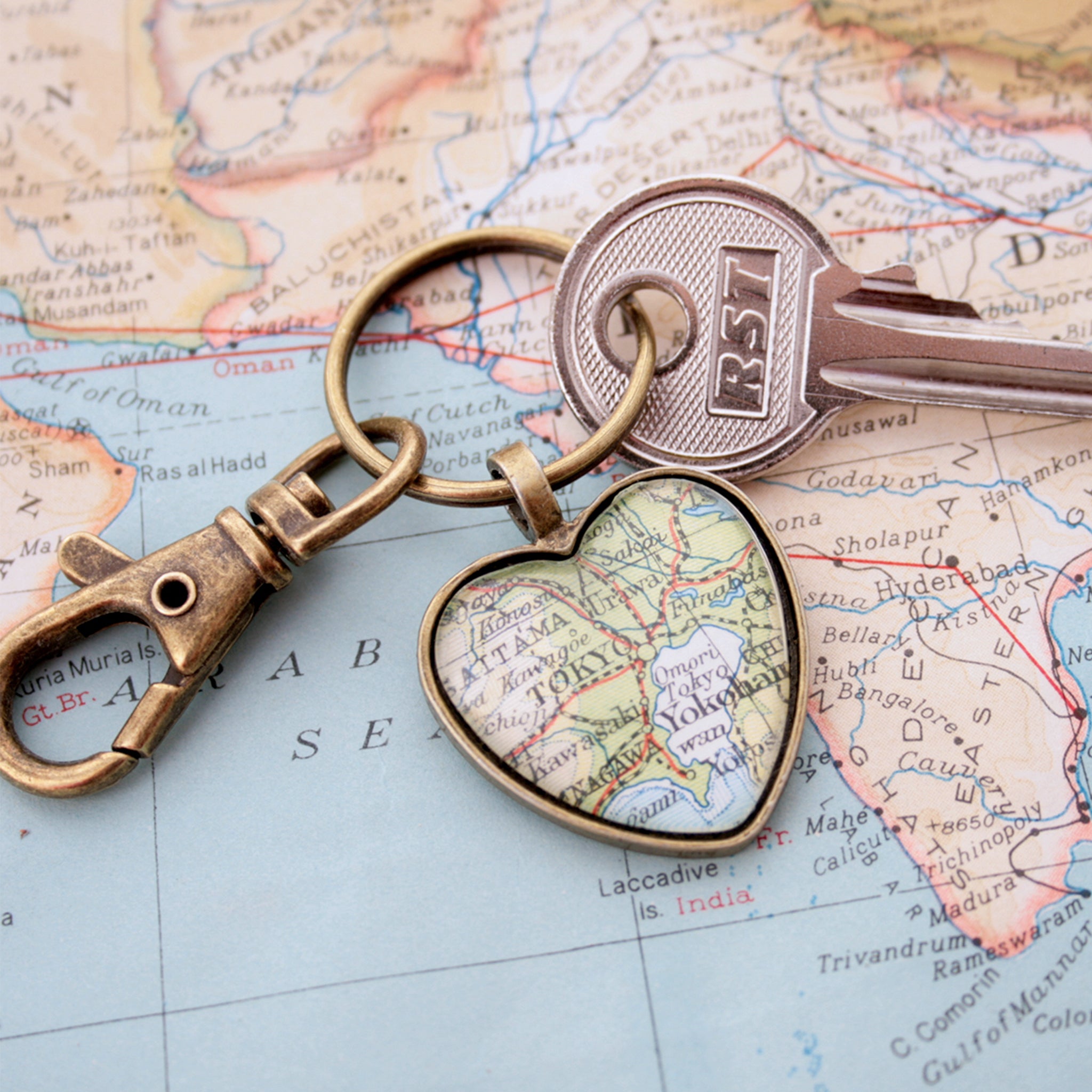 Heart shaped keychain in bronze tone featuring map of Tokyo