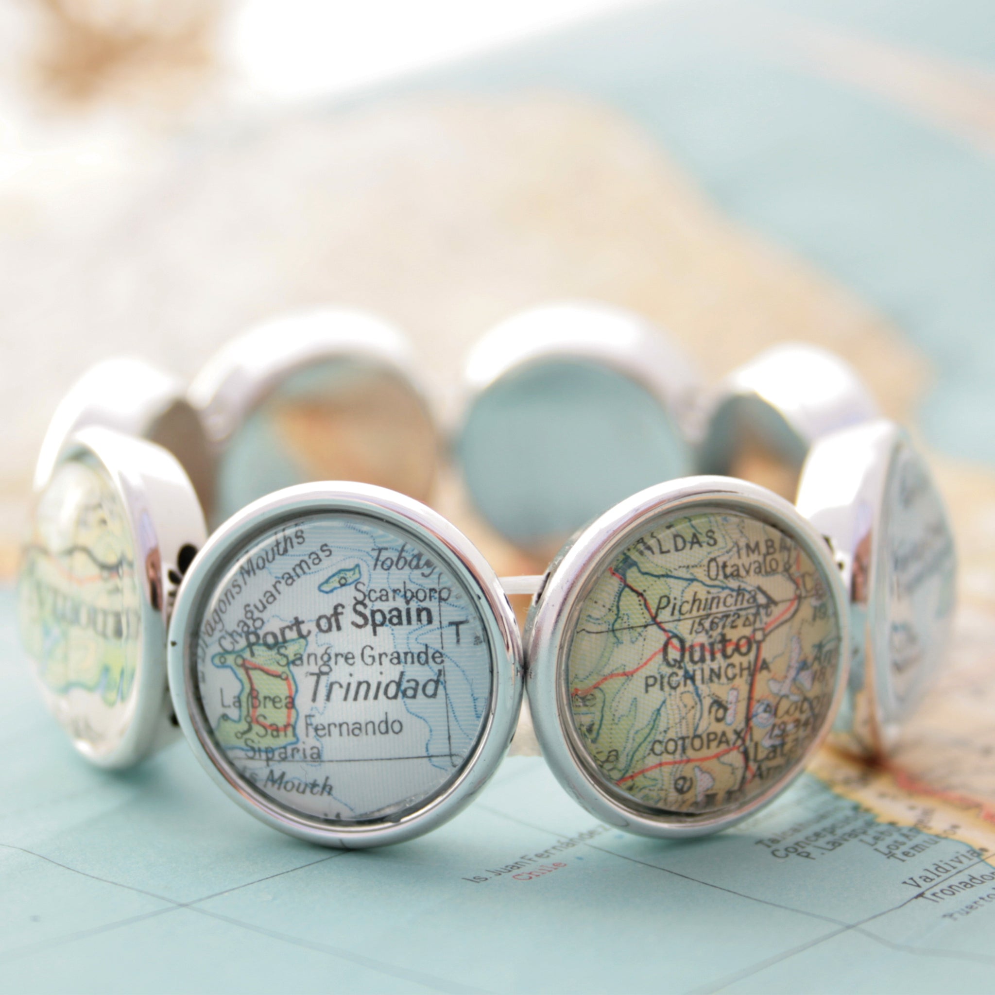 Stretchy bracelet in silver tone featuring custom map locations