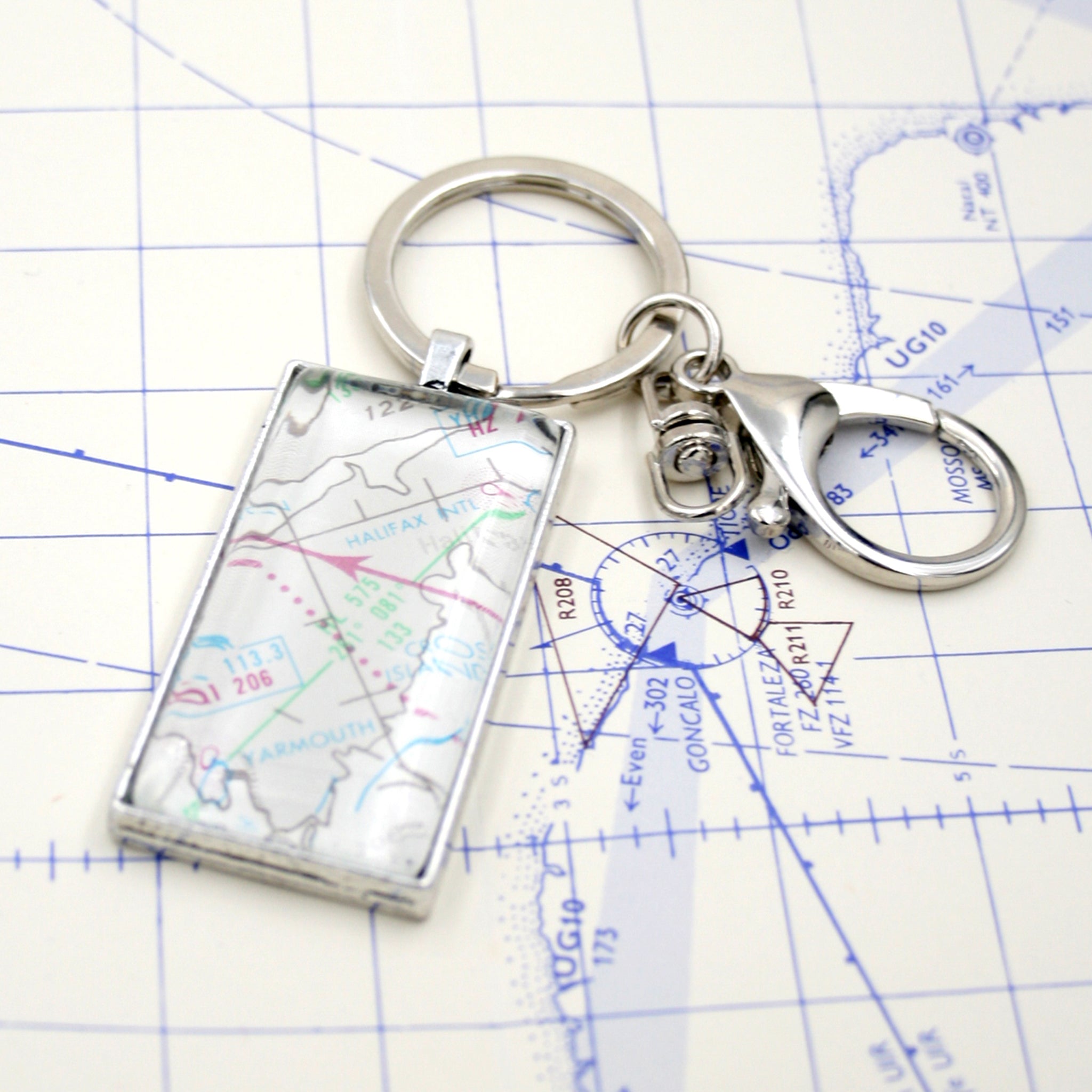 Rectangular, silver keychain featuring aeronautical chart 
