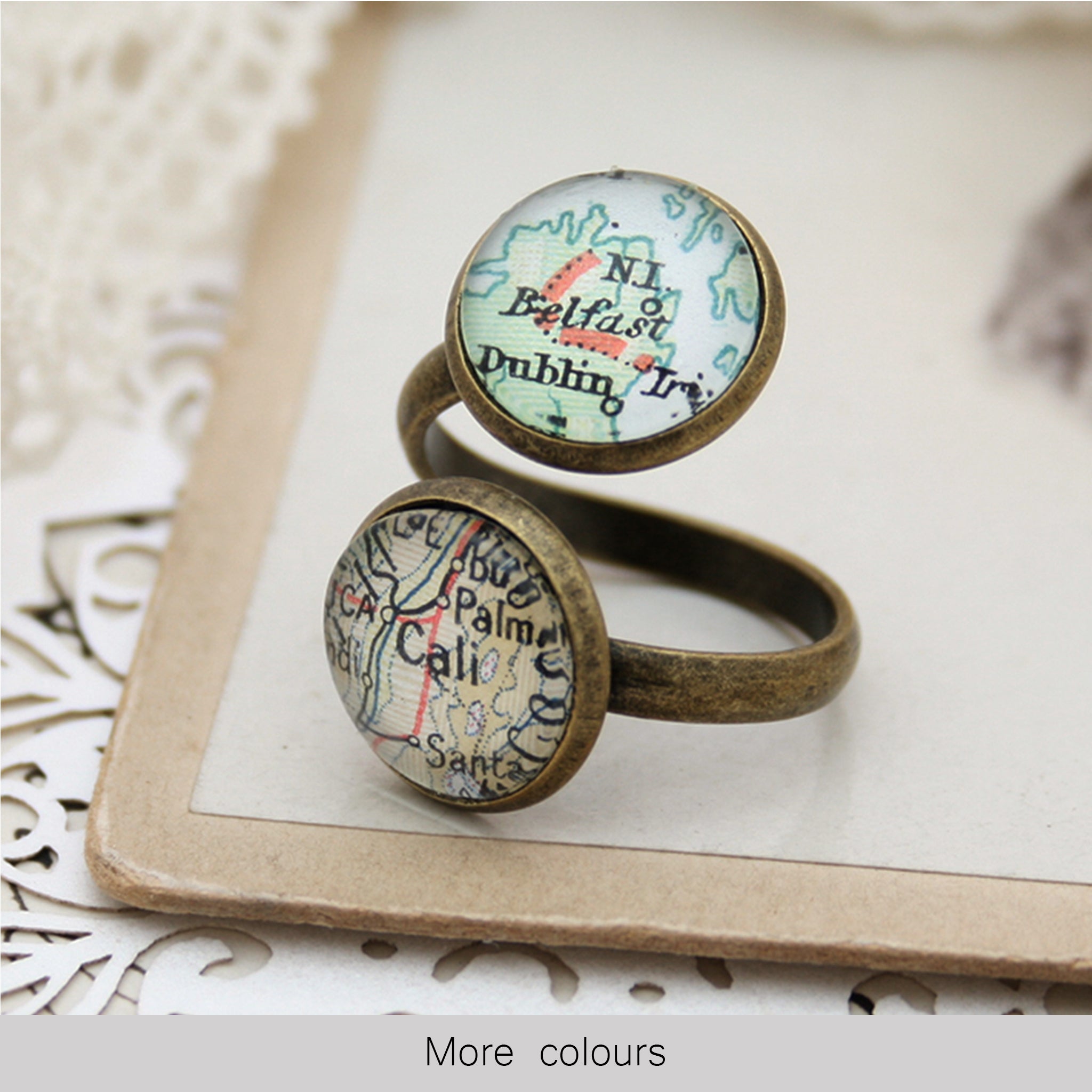 Thumb ring in antique bronze color featuring to custom map locations