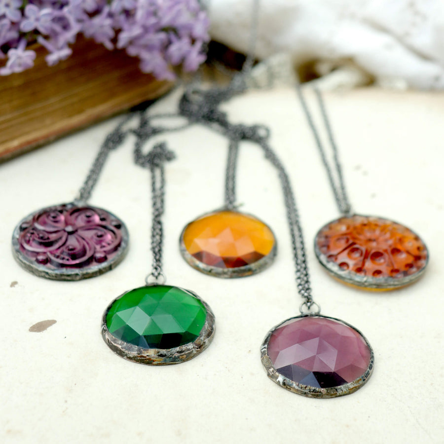 Amethyst, emerald and amber glass soldered into stained glass necklaces