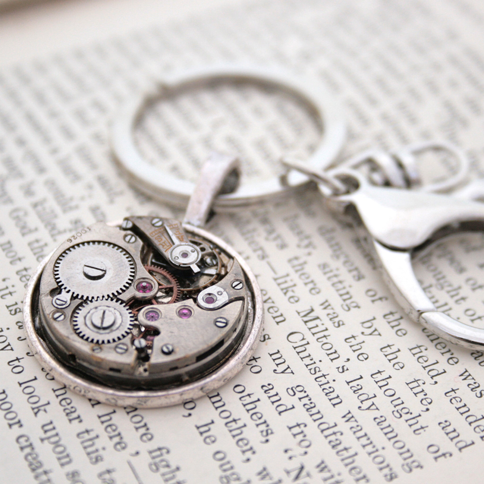 steampunk keyring for man, made of real antique watch movement on metal base in silver tone