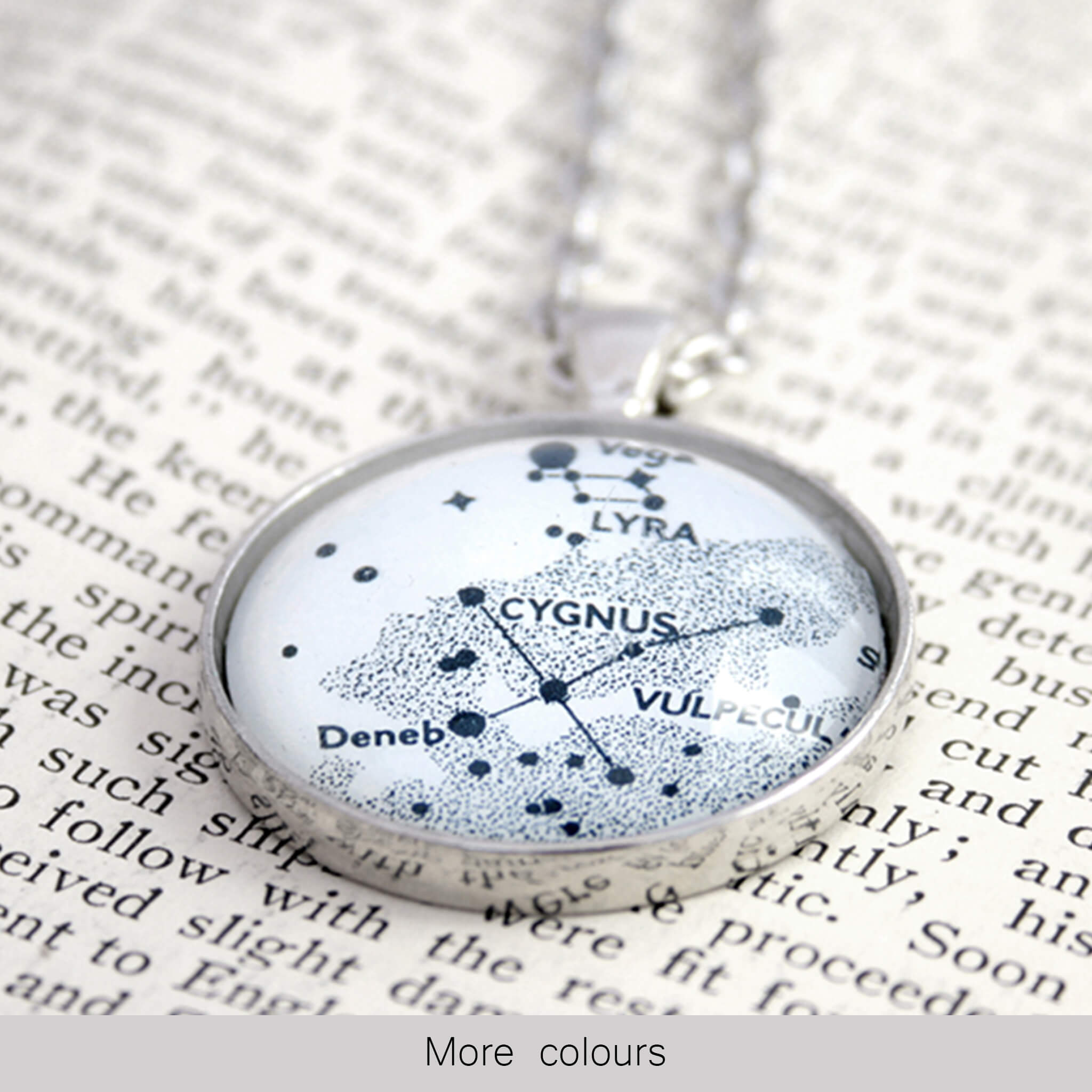 Silver tone pendant necklace featuring map of Cygnus and Lyra constellations