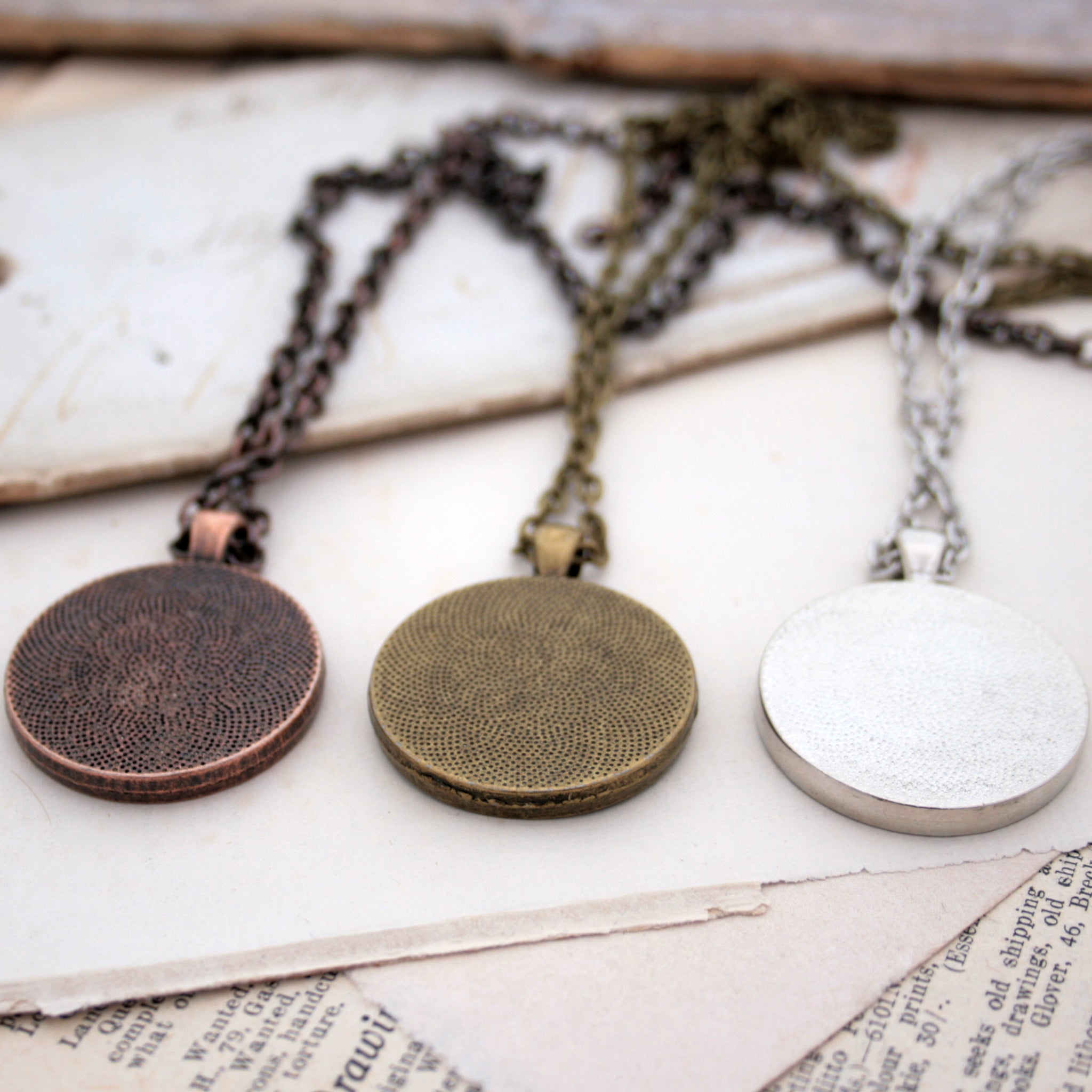 Copper, bronze and silver necklaces on the backside