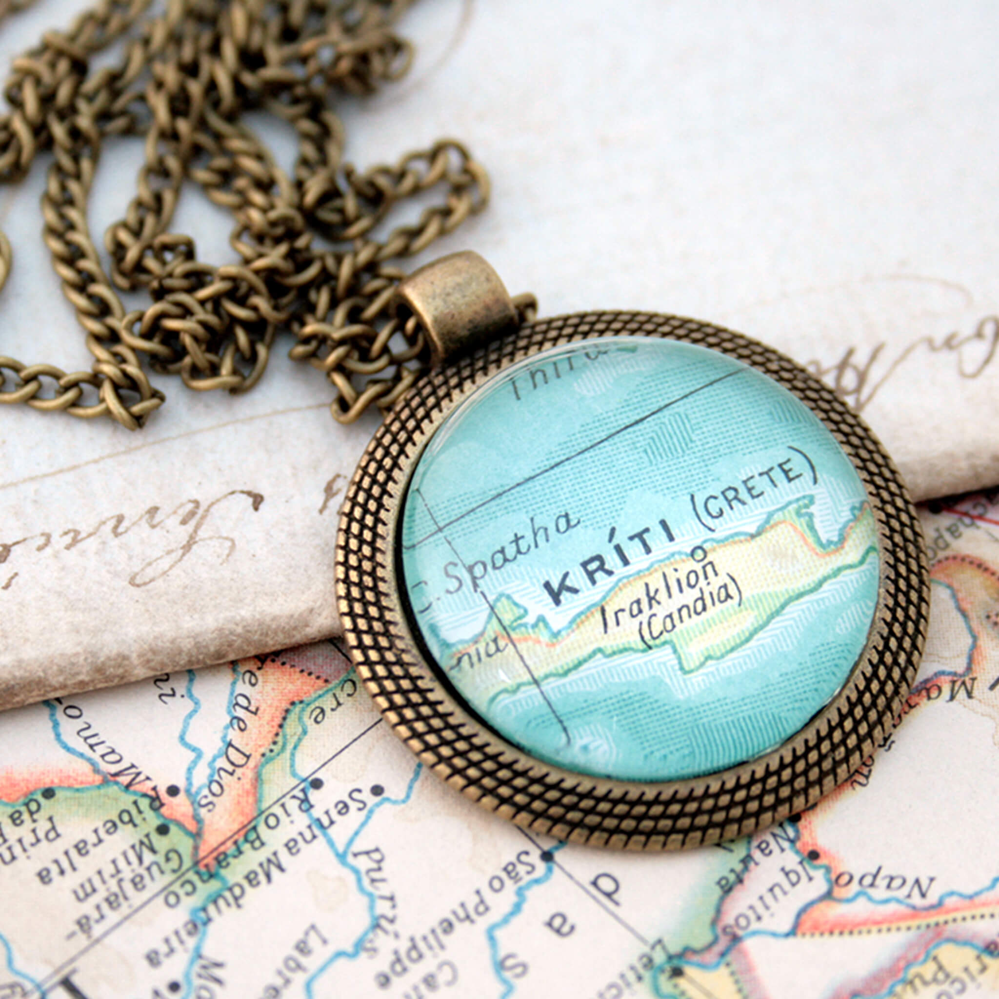 bronze coloured pendant necklace with map of Kriti