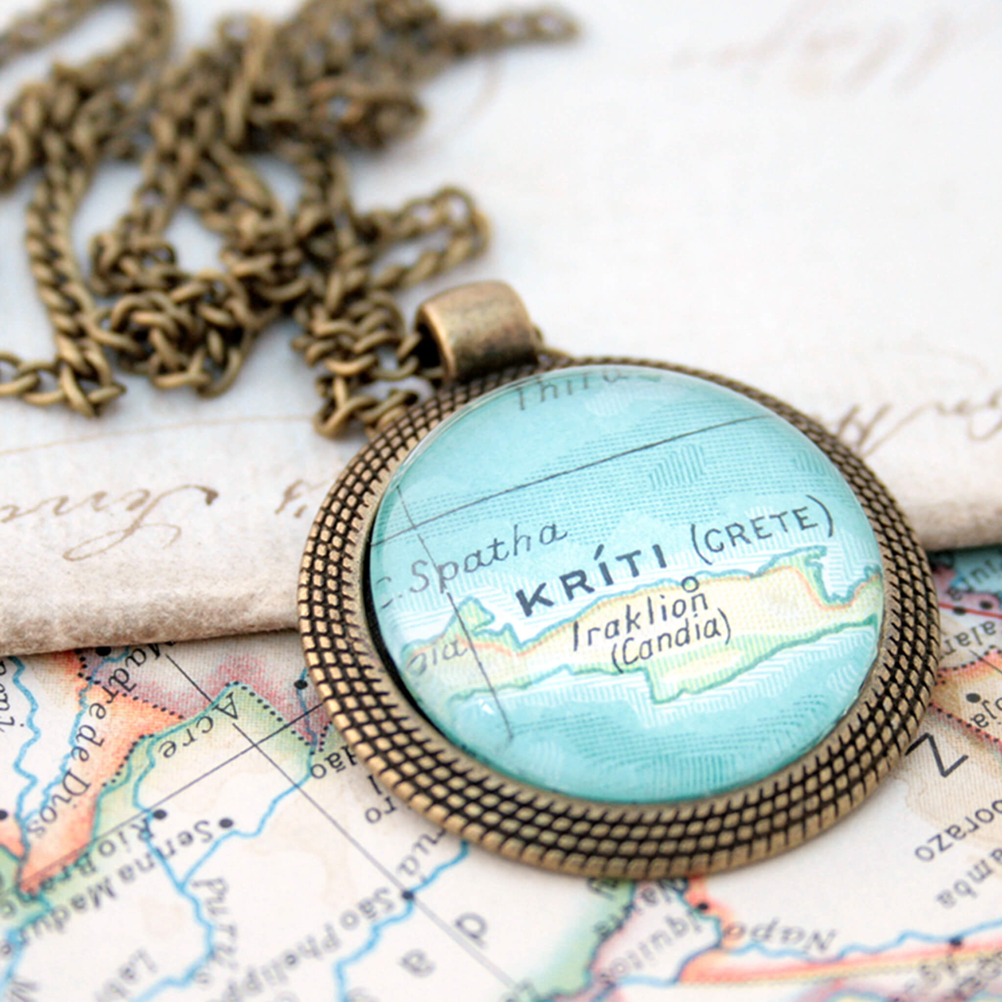 bronze coloured pendant necklace with map of Kriti